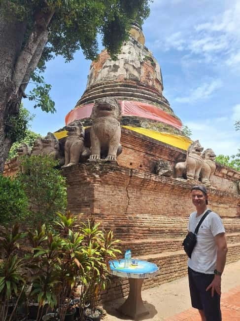 Ayutthaya: Colorful Slow Life Bicycle Tour with local guide. - Wat Mahathat and the Buddha head in the roots