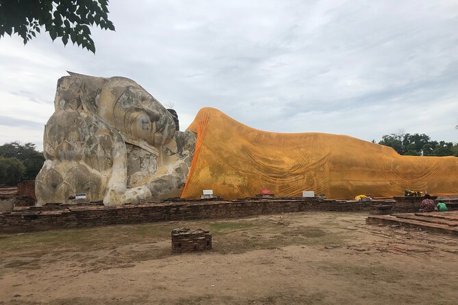 Ayutthaya Day Tour By Coach and Cruise - Wat Mahathat and the Buddha head in the tree roots