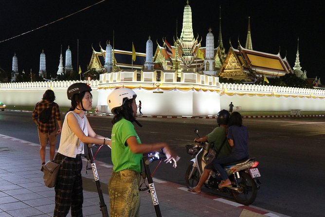 Bangkok at Night by Electric Scooter - The Grand Palace lit up at night