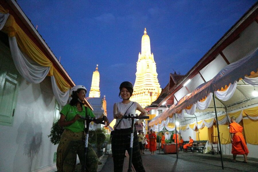 Bangkok: E-Scooter Night Tour with Local Street Food - Through quieter lanes toward the river