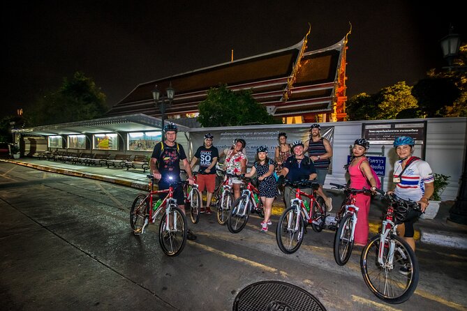 Bangkok: Night Bike Tour with Temples & Flower Market Visit - Crossing the Chao Phraya by local ferry