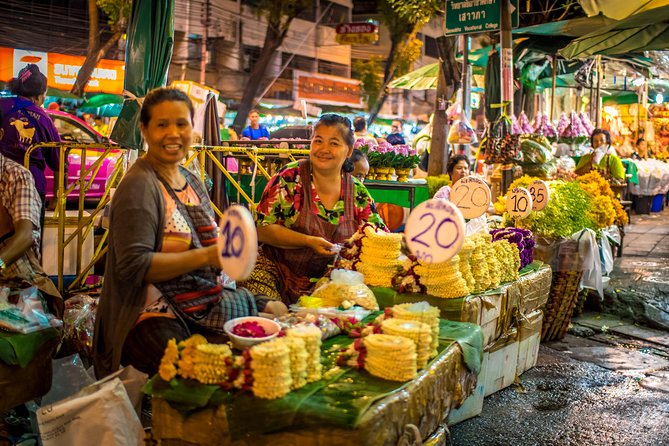 Bangkok: Night Bike Tour with Temples & Flower Market Visit - Wat Rakang and the lit spires of Wat Arun