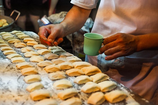 Flavors of Bangkok: Small-Group Chinatown Evening Food Tour - The red Chinese gate and Mittaphap Thai-China Road