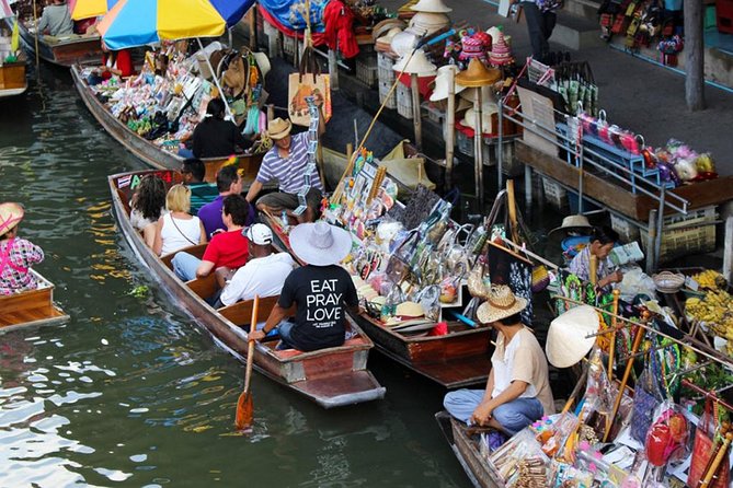 Floating Market Damnoen Saduak and Meklong Railway Market: Half Day Tour - Maeklong Railway Market and the train moment