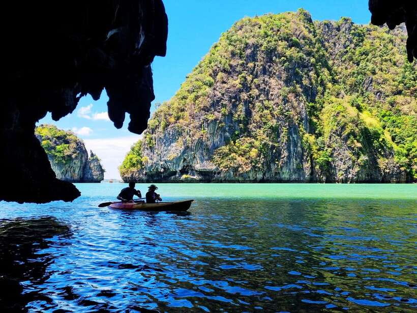 Koh Lanta: Sea Cave Kayaking and Talabeng Island Tour - Riding a longtail boat around Ung Island
