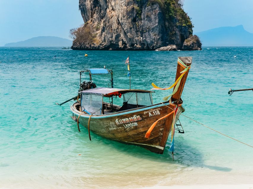 Krabi: 4 Islands Tour by Longtail Boat & Thai Buffet Lunch - Railay and Phra Nang Cave Beach: cliffs, sand, and a curious shrine