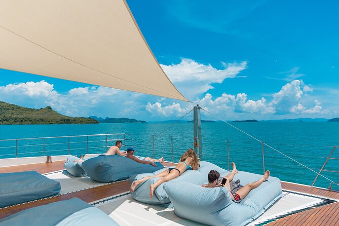 Luxury Boat to James Bond Islands with Lunch and Sunset Dinner - The catamaran, seating, and party atmosphere