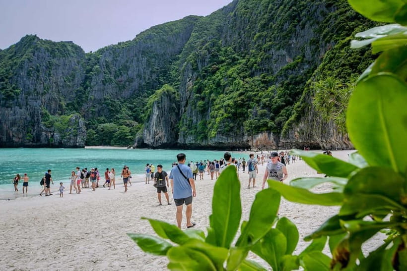 Phi Phi: 7 Island Longtail Boat Snorkeling Tour with Sunset - Pileh Lagoon is the first big water stop