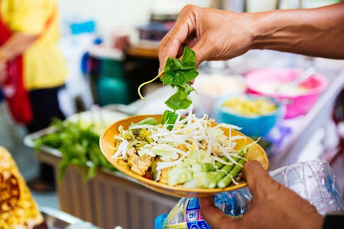Private Culinary Kickstart Tour of Bangkok with a Local - First tastes: salad, curry, and banana fritters