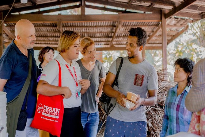 Private Tour from Bangkok: Railway and Floating Markets Tour - The family palm sugar stop adds local context