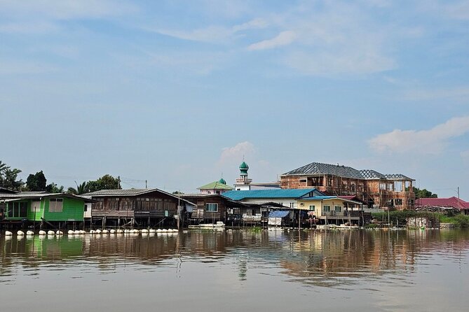 Unique and Scenic Slow Boat Tour from Bangkok to Ayutthaya - Arriving near Ayutthaya’s temples